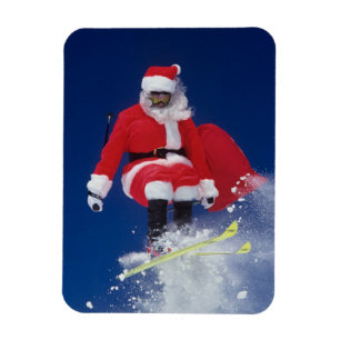 Imán Papá Noel en el salto de esquís de una cornisa e