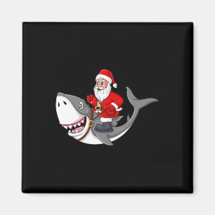 Imán Papá Noel viajando en Navidades de tiburones niños