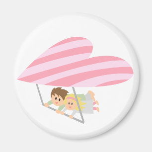 Imán Pareja linda volando en un ala delta con forma de