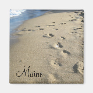 Imán Pasos en una playa arenosa (Maine)