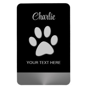 Imán Paw de perro plateado sobre fondo negro