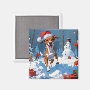 Imán Perro Basenji jugando en la escena de invierno