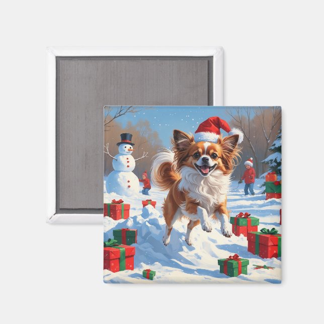 Imán Perro Papillon corriendo en la nieve con sombrero  (Anverso/Reverso)