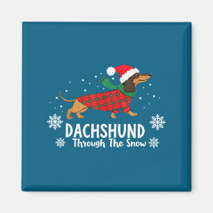 Imán Perro salchicha de Navidad a través de la nieve Sa