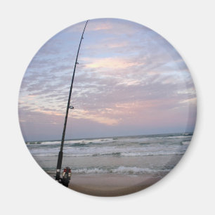 Imán Pesca de la playa en la puesta del sol