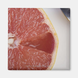 Imán Primer de una rebanada de naranja y de una cuchara