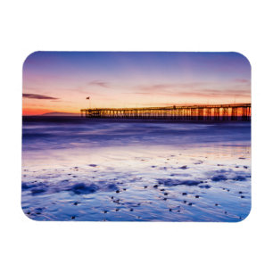Imán Puesta de sol sobre el muelle y la playa de Ventur
