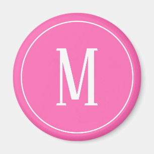 Imán redondo con monograma blanco sobre rosa