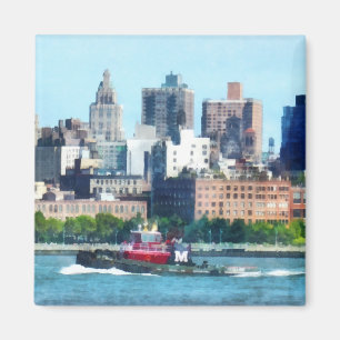 Imán Remolcador contra el horizonte de Manhattan