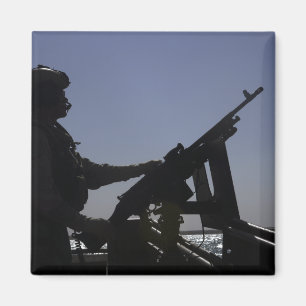 Imán Técnico que sirve una ametralladora M240 en Iraq