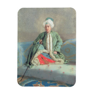 Imán Un caballero asentado en un sofá