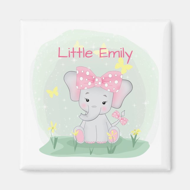 Imán Un elefante pequeño con una proa rosa en un claro (Frente)