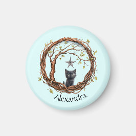 Imán Un gatito negro lindo mirando una estrella