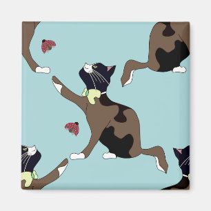 Imán Un gato con un arco atrapa a una mariquita.