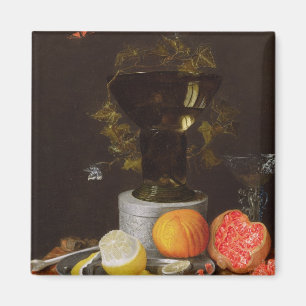 Imán Una vida inmóvil con un vidrio y una fruta en una