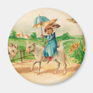 Imán Vintage Easter Bunny Rabbit Riding Lambs Saludos
