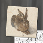 Imán Young Hare | Albrecht Dürer<br><div class="desc">La Young Hare de Albrecht Dürer (1502) es una pintura acuarela meticulosamente detallada que muestra una representación de liebre parecida a la realidad. Reconocido por su extraordinario realismo, el arte captura la textura de la piel de la liebre, la delicada luz en sus ojos y el sutil juego de las...</div>