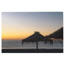 La puesta de sol en la playa