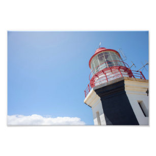 Impresión fotográfica de faro contra el cielo