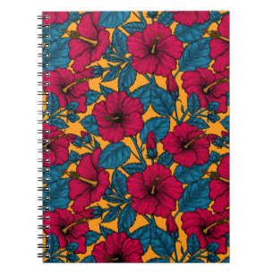 Inhibiscos rojos en cuaderno naranja