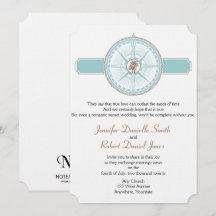 Boda Rosa de playa con brújula azul y dorada