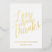 Amor y gracias por la caligrafía de oro Foto