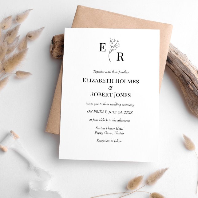 Invitación Elegante Boda de Monograma Floral Blanco y Negro (Elegant Black and White Floral Monogram Wedding Invitation on white table with neutral boho decor.)