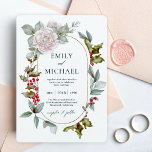 Invitación Romantic Winter Floral and Evergreens Wedding<br><div class="desc">This wonderfully elegant and unique winter wedding invitation was designed especially for weddings during the Christmas holiday season and the winter months. Romantic pink roses mix with beautiful evergreens and holly with red berries to form a perfectly gorgeous combination. The oval frame surrounding your text adds to the tasteful design....</div>