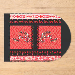 Invitaciones Acrílicas un patrón rojo y negro con flores sobre él