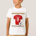 Jersey de fútbol rojo y blanco personalizado<br><div class="desc">Una camiseta personalizada de fútbol de fútbol de rojo con guarnecido blanco, colgada en un vestuario deportivo con una botella de agua, botellas de fútbol y una pelota de fútbol. Sólo tienes que añadir el nombre y el número (o edad) del jugador de fútbol, hincha de fútbol o entrenador del...</div>