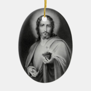 Jesús que sostiene un ornamento religioso del