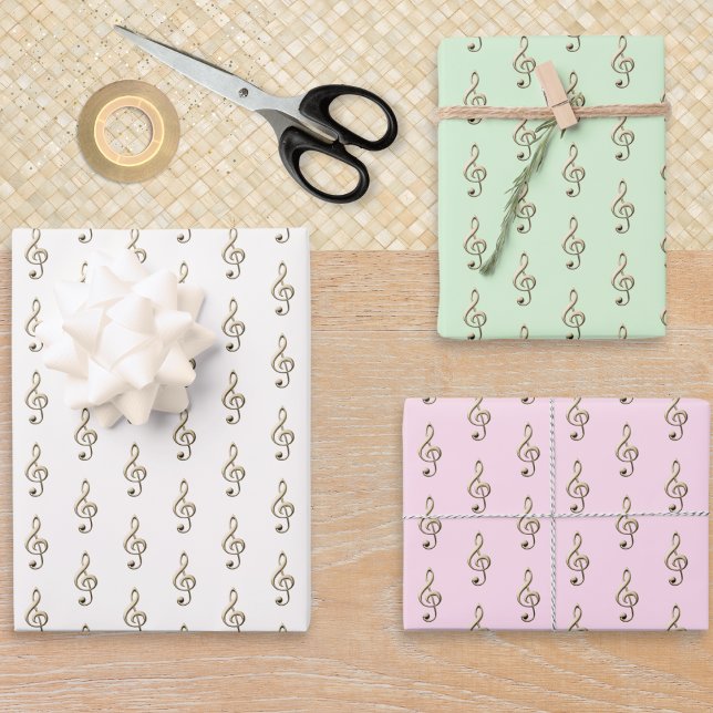 Juego de 3 papel musical en clave de sol crema ver (A set of 3 wrapping paper sheets, in pink, green and white, with faux gold treble clefs pattern)