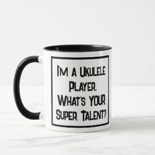 Jugador de Ukulele Super Talent. Dos tazas de café