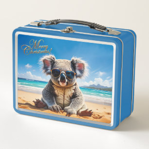 Koala en una playa de arena Feliz Navidad