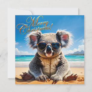 Koala en una playa de arena Feliz Navidad