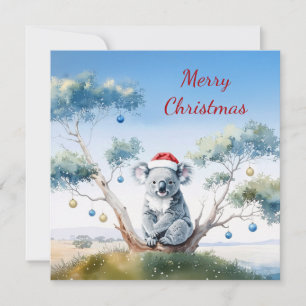 Koala sentado en un árbol de goma Feliz Navidad