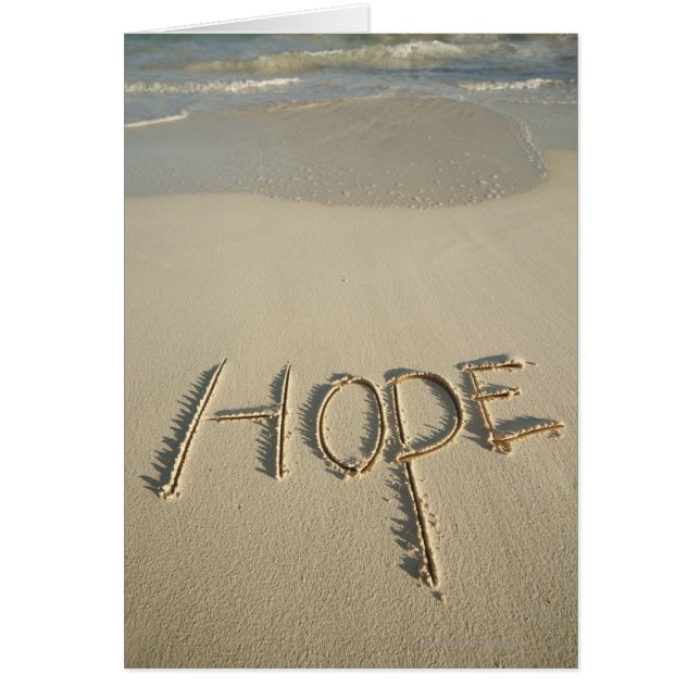 La arena "Hope" escrita en la playa con (Frente)