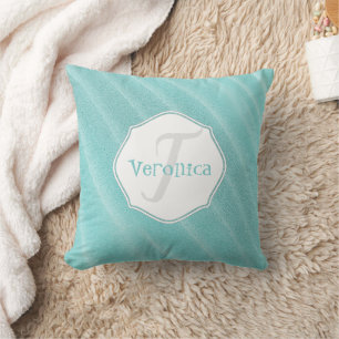 La arena verde azulada riega la almohada personali