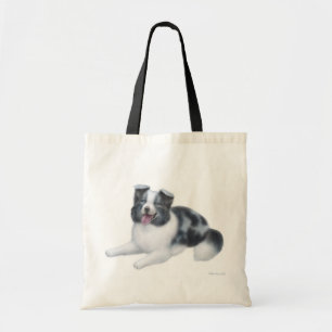 La bolsa de asas azul de Merle del border collie