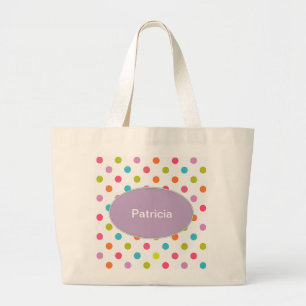 La bolsa de asas colorida del monograma