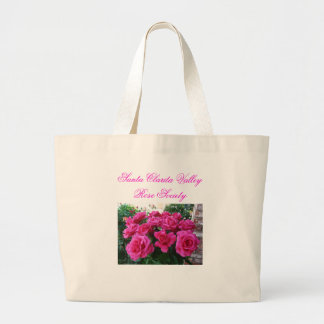 La bolsa de asas con los rosas rosados