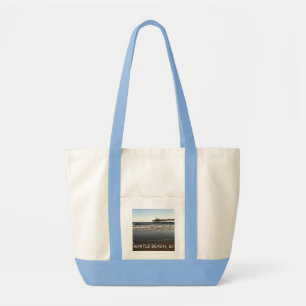 La bolsa de asas, océano y embarcadero de la lona