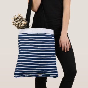 La bolsa de asas rayada grande