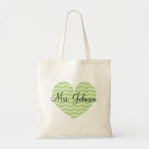 La bolsa de asas verde del galón del corazón par