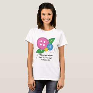 La camiseta del botón de la estación de la