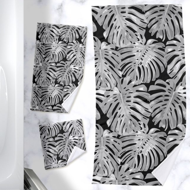 La jungla tropical deja al negro gris moderno (Black and gray bath towels with tropical leaves pattern)
