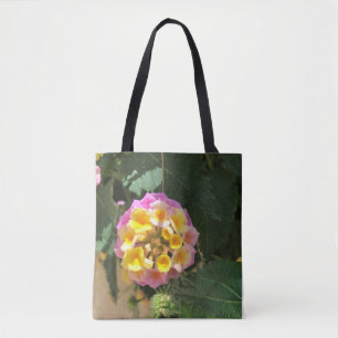 La mi bolsa de asas rosada y amarilla de la flor