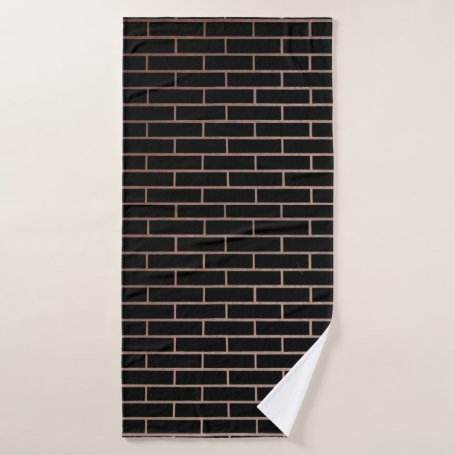 La pared de ladrillo negro oscuro tiene una superf (Toalla de baño)