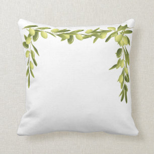 La rama de olivo en blanco sale de la almohada del