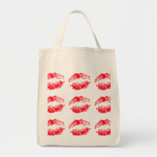 Labios rojos que besan la bolsa de asas